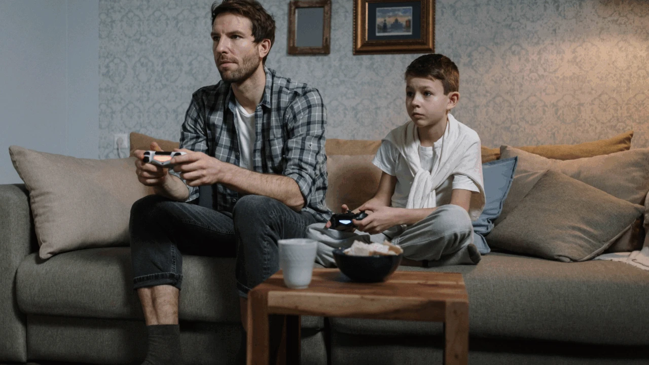 A father with his son playing video games