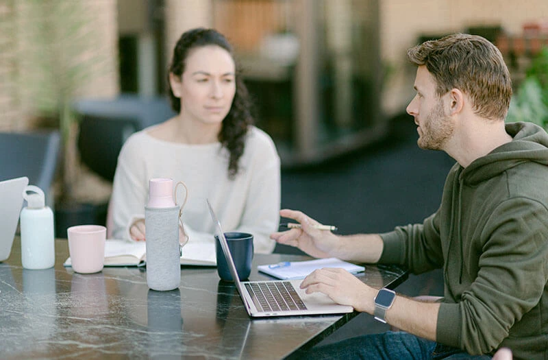 Two people co working